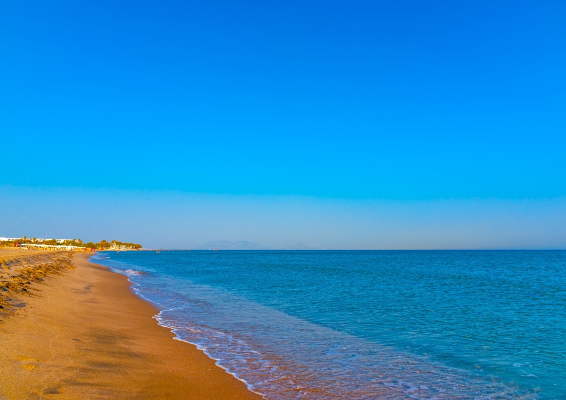 'the beautiful long sandy beach at Chelona cape near Kardamaina village at Kos island in Greece' - Kos